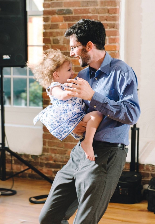 Jeff Kaufman ’08 dances with his daughter Lily